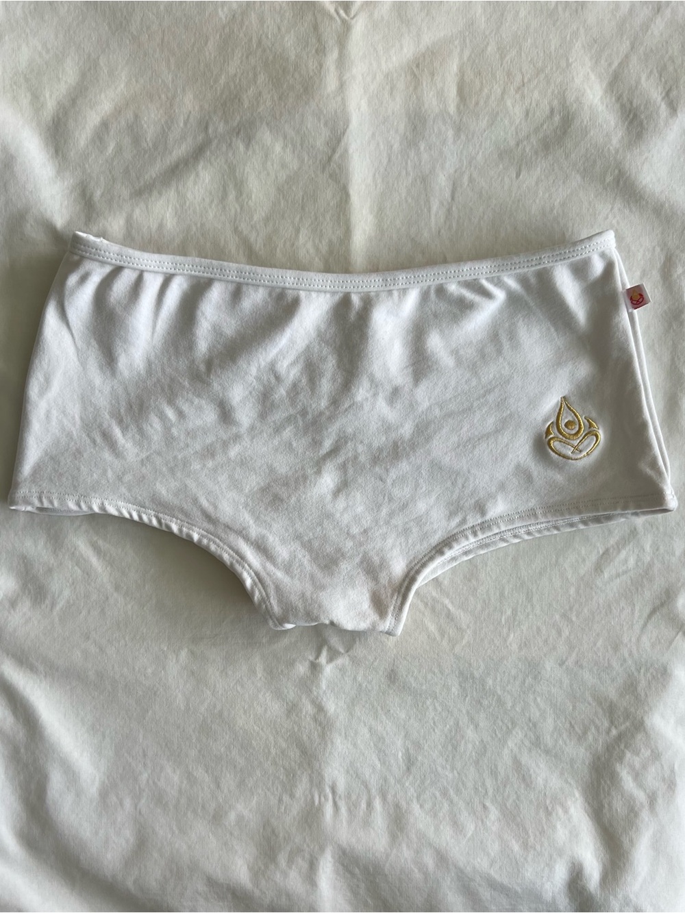 Shakti Women's White Hot Yoga Boyshorts with Gold Logo S